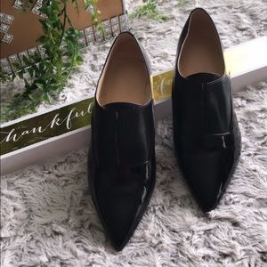 Size 7 Patent leather black flats.